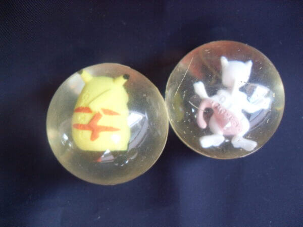 Pikachu and Mewtwo rubber bouncy ball toys, back view.