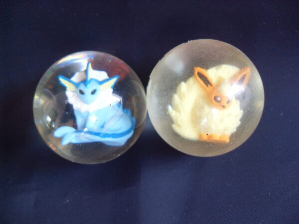 Flareon and Vaporeon rubber bouncy ball toys, front view.