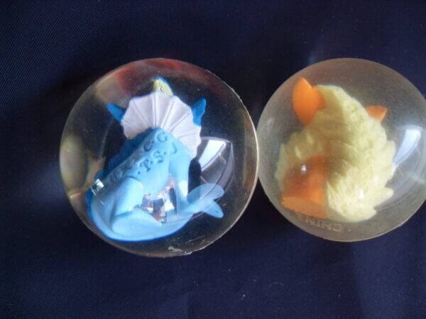 Flareon and Vaporeon rubber bouncy ball toys, back view.