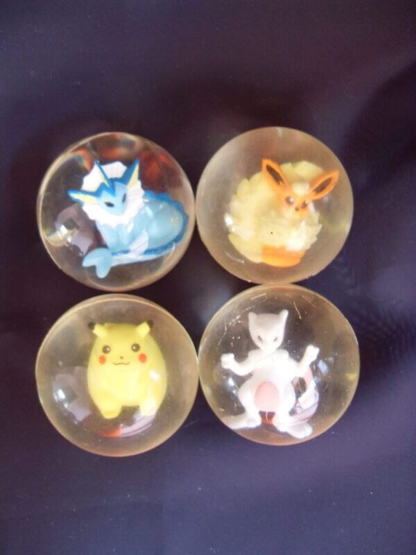 Vaporeon, Pikachu, Flareon, and Mewtwo rubber bouncy ball toys.