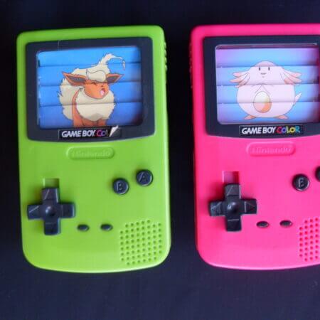 Gameboy Color plastic toys with Pokemon images across the fake screens.