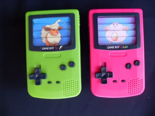 Gameboy Color plastic toys with Pokemon images across the fake screens.