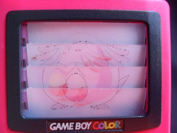 Pink Gameboy Color toy with Chansey image.