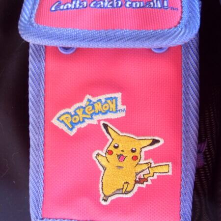 Pink and purple embroidered Pikachu Gameboy carrying case.