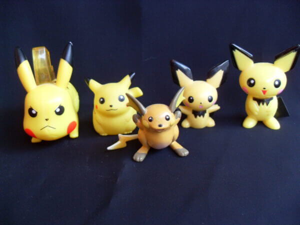 Pikachu, Pichu, and Raichu plastic figurines.