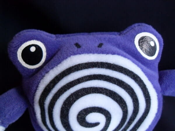 1999 Pokemon plush toy Poliwhirl, face close-up.