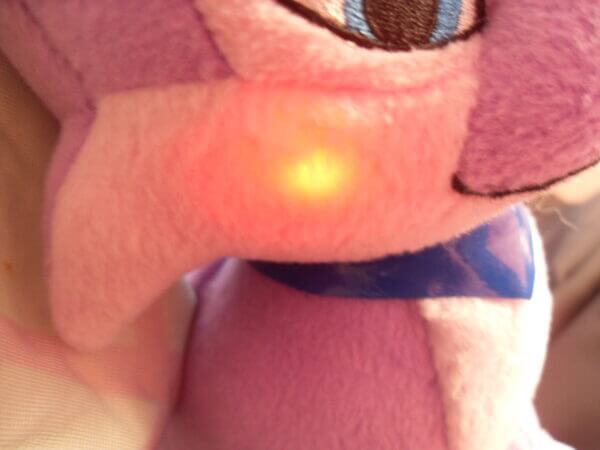2004 Neopets Talking Faerie Ixi plush toy, flashing cheek close-up to demonstrate functionality.