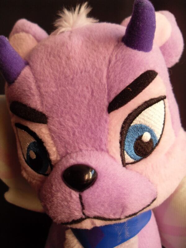 2004 Neopets Talking Faerie Ixi plush toy, face close-up.