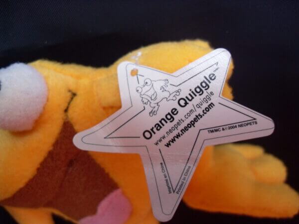 2005 Neopets McDonald's promo plush toy, Orange Quiggle tag.
