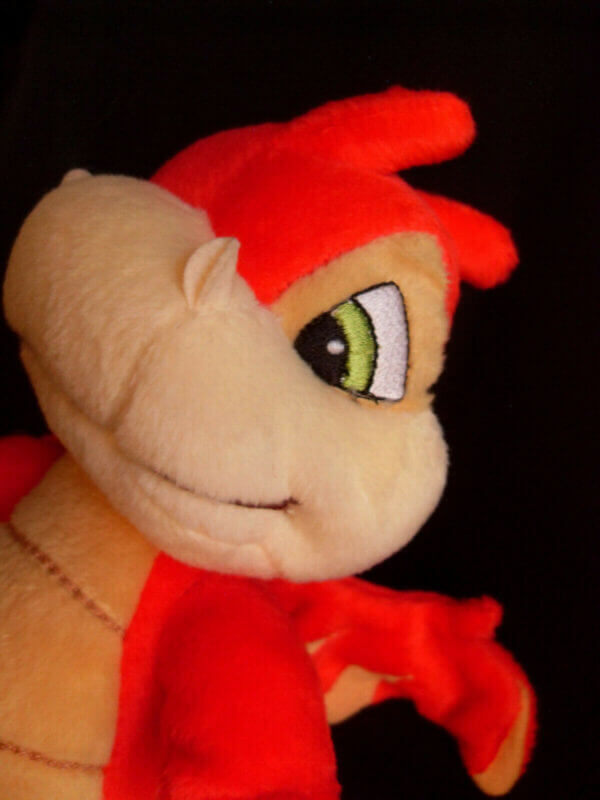 2002 Neopets Red Scorchio plush toy, face detail.