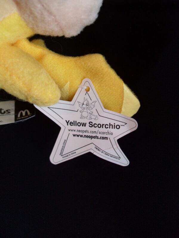 2005 Neopets McDonald's promo plush toy, Yellow Scorchio tag.