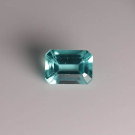 Apatite, 7x5mm octagon cut, front view.
