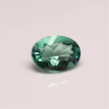 Green Fluorite, 8x6mm oval, front view.