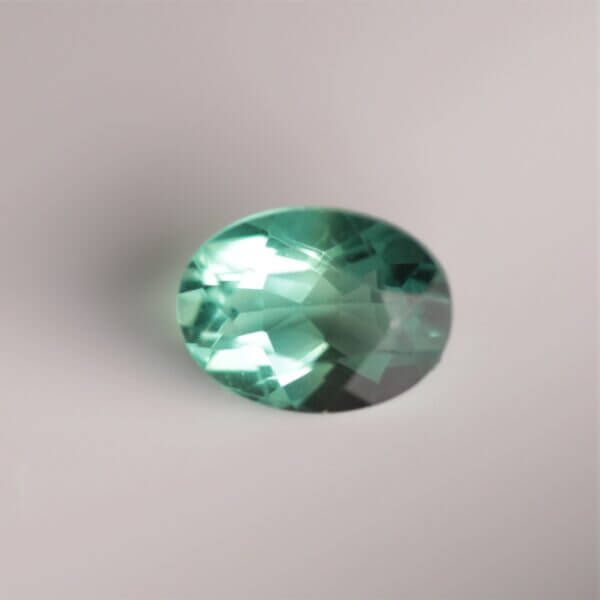 Green Fluorite, 8x6mm oval, top view.