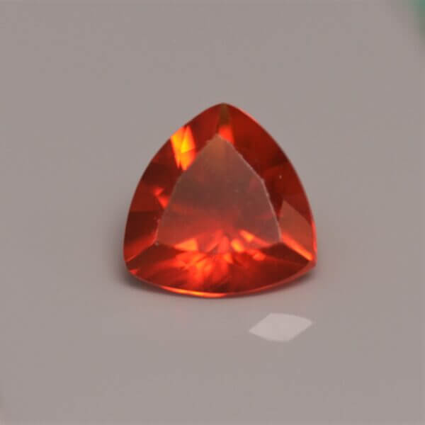 Mexican Fire Opal, 7mm round cut, front view.