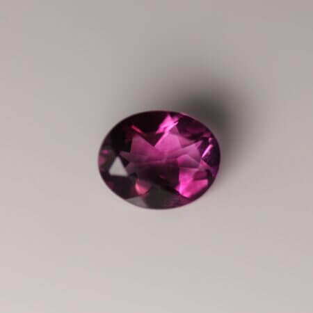 Pink Fluorite, 10x8mm oval cut, top view.