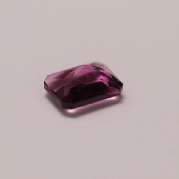 Pink Fluorite, 8x6mm octagon cut, side view.