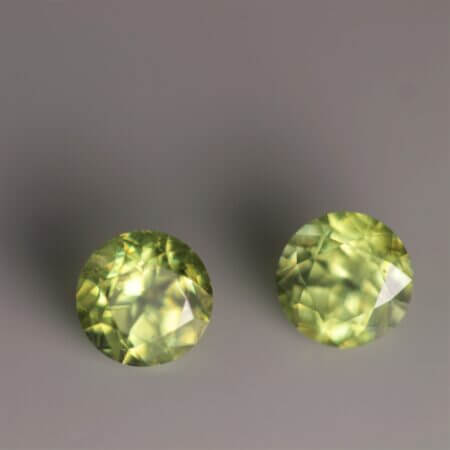 Green Sphene, 5mm round matched pair, top view.