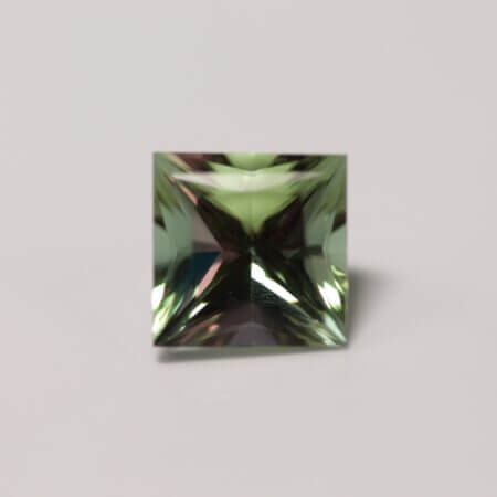 Color change Zandrite while green, 10mm square, front view.