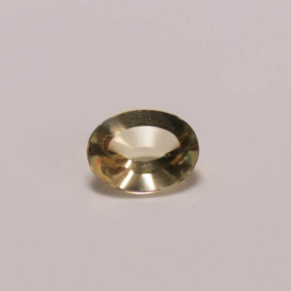 Heliodor, 8x6mm concentric cut oval, top view.