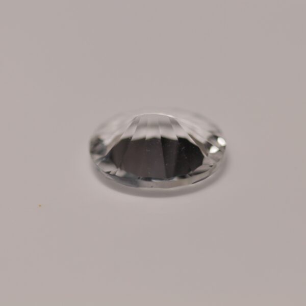 Petalite, 10x8mm quantum cut oval, bottom view.
