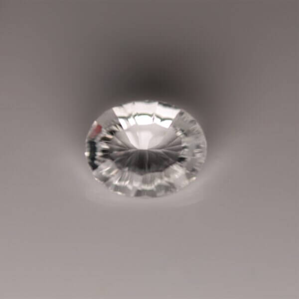 Petalite, 10x8mm quantum cut oval, front view.