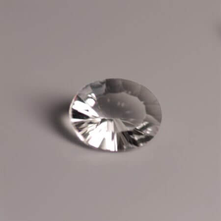Petalite, 10x8mm quantum cut oval, top view.