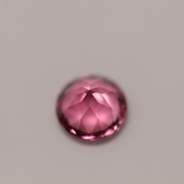 Pink Tourmaline, 5.2mm round cut, side view.