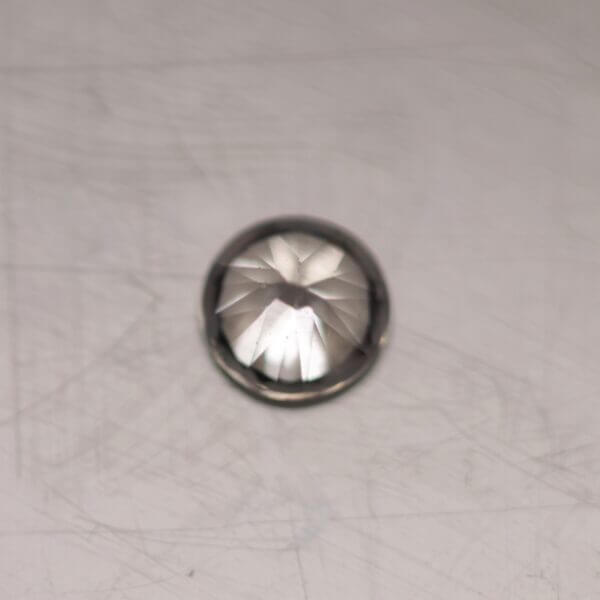 White Zircon, 4.5mm round cut, bottom view.