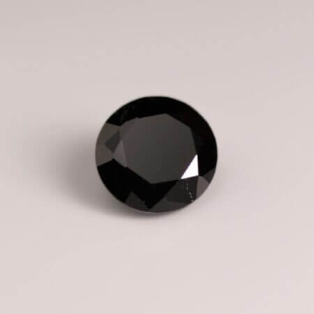 Black Spinel, 8mm round cut, front view.