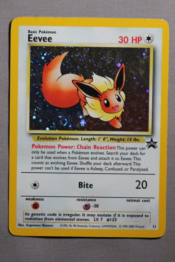 Eevee (11), the WOTC Black Star promo holofoil card, front view.