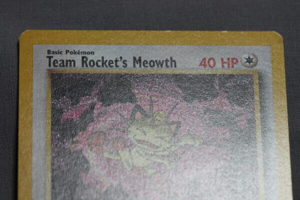 Team Rocket's Meowth (18), the WOTC Black Star promo card, detail shot (2/4).