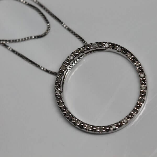 Sterling Silver and Diamond circle pendant, front view.