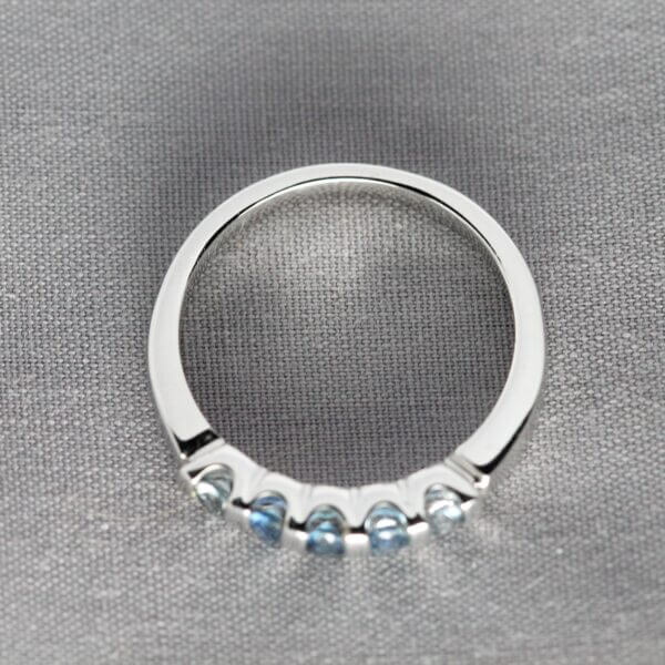 14kt White Gold and Blue Montana Sapphire stacking ring, top view.