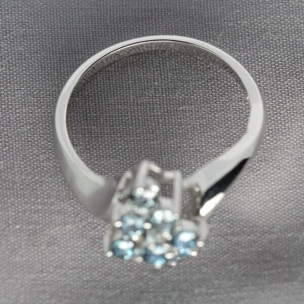 14kt White Gold and 9 stone gradient Blue Montana Sapphire ring, top view.