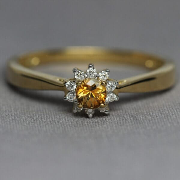 14kt Yellow Gold, Diamond, and Orange Montana Sapphire flower ring, stone view.