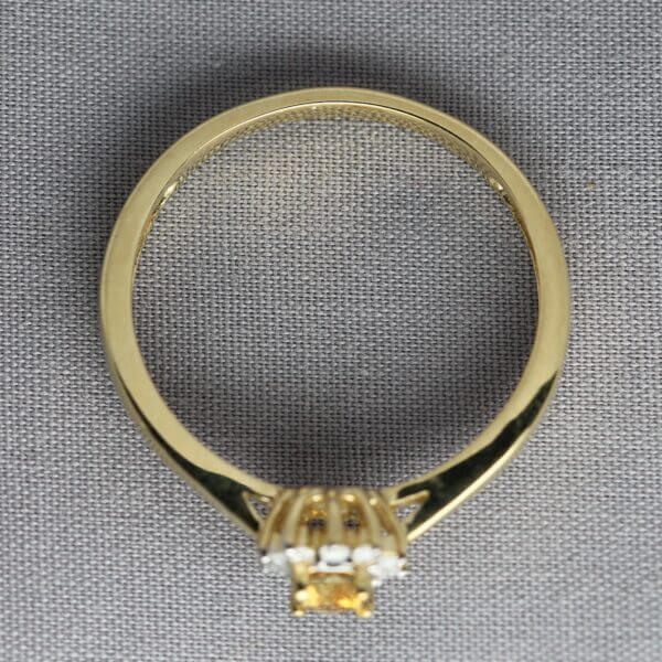 14kt Yellow Gold, Diamond, and Orange Montana Sapphire flower ring, side view.
