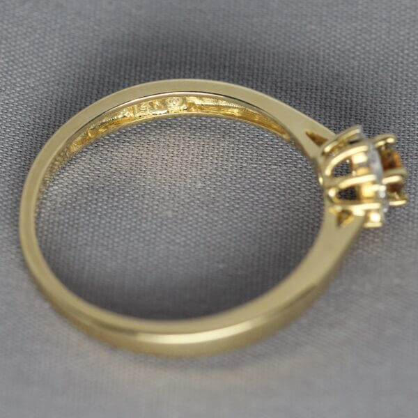 14kt Yellow Gold, Diamond, and Orange Montana Sapphire flower ring, mark view.