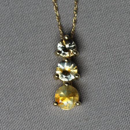 14kt Yellow Gold and 3 stone Kaleidoscope Montana Sapphire pendant, front view.