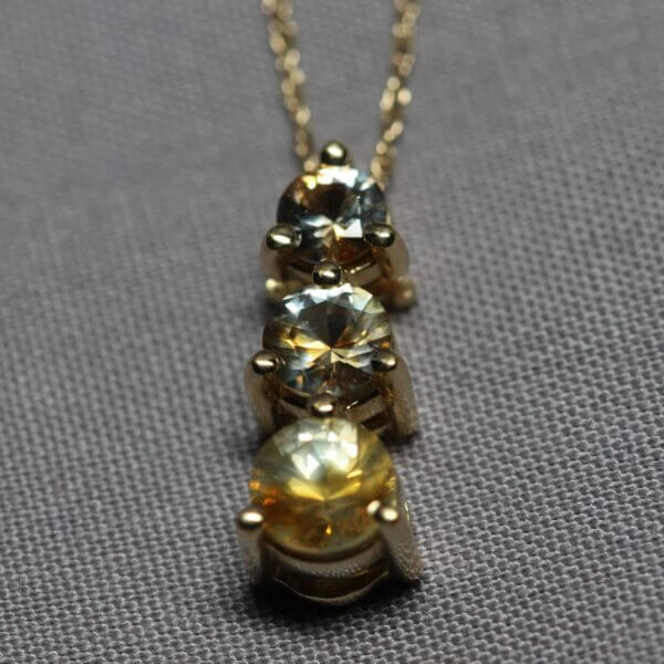 14kt Yellow Gold and 3 stone Kaleidoscope Montana Sapphire pendant, top view.