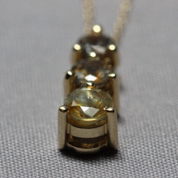 14kt Yellow Gold and 3 stone Kaleidoscope Montana Sapphire pendant, stone view.