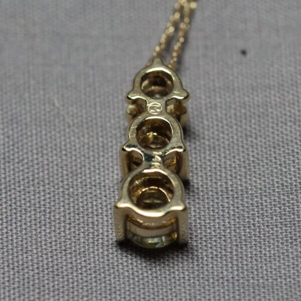 14kt Yellow Gold and 3 stone Kaleidoscope Montana Sapphire pendant, back view.