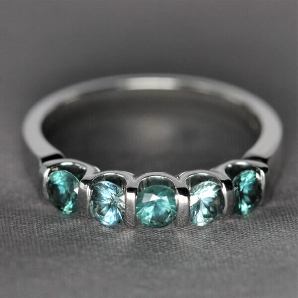 14kt White Gold and 5 stone Green Montana Sapphire ring, top view.