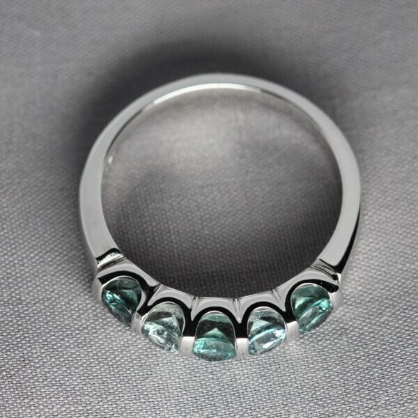 14kt White Gold and 5 stone Green Montana Sapphire ring, side view.