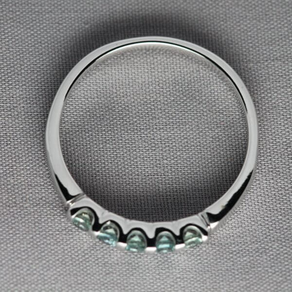 14kt White Gold and Green Montana Sapphire stacking ring, side view.