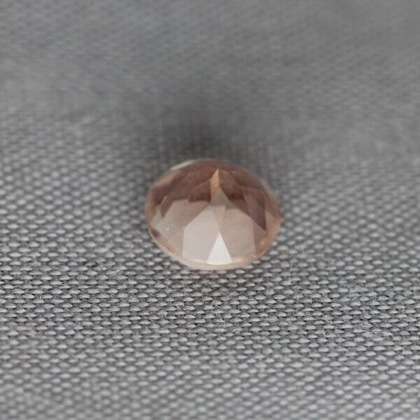 Oregon Sunstone, 5mm round cut, bottom view.