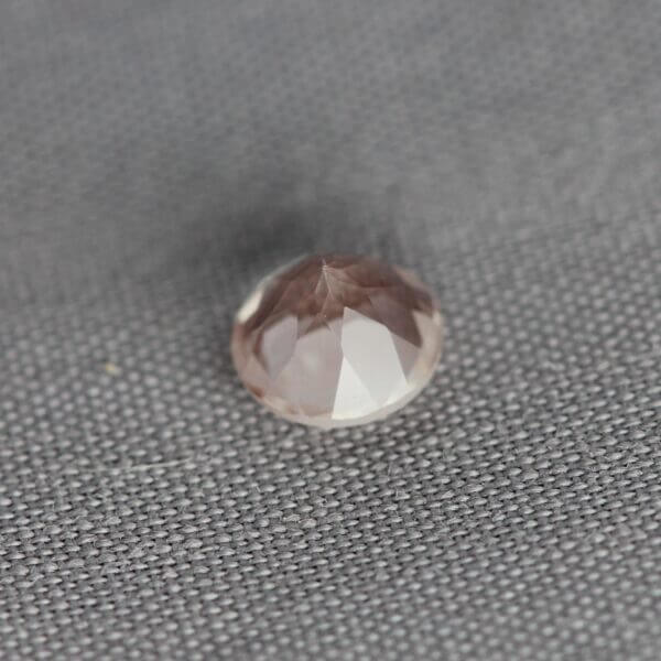 Oregon Sunstone, 5mm round cut, bottom view.