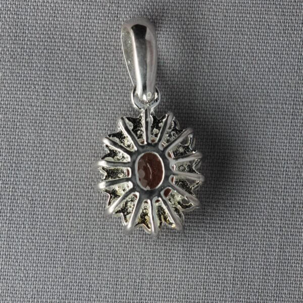 Sterling Silver, White Topaz, and Oregon Sunstone pendant, back view.
