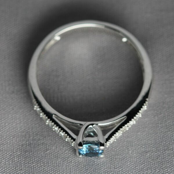 14kt White Gold, Diamond, and Blue Montana Sapphire solitaire ring, side view.