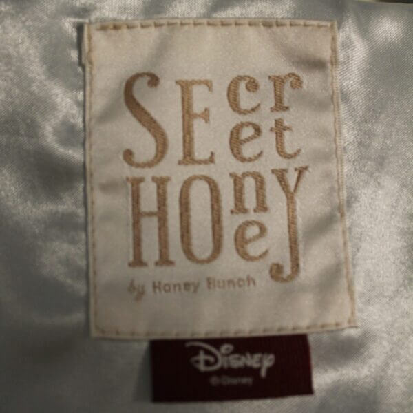 Secret Honey brand Disney's Frozen themed capelet, official branding tags.